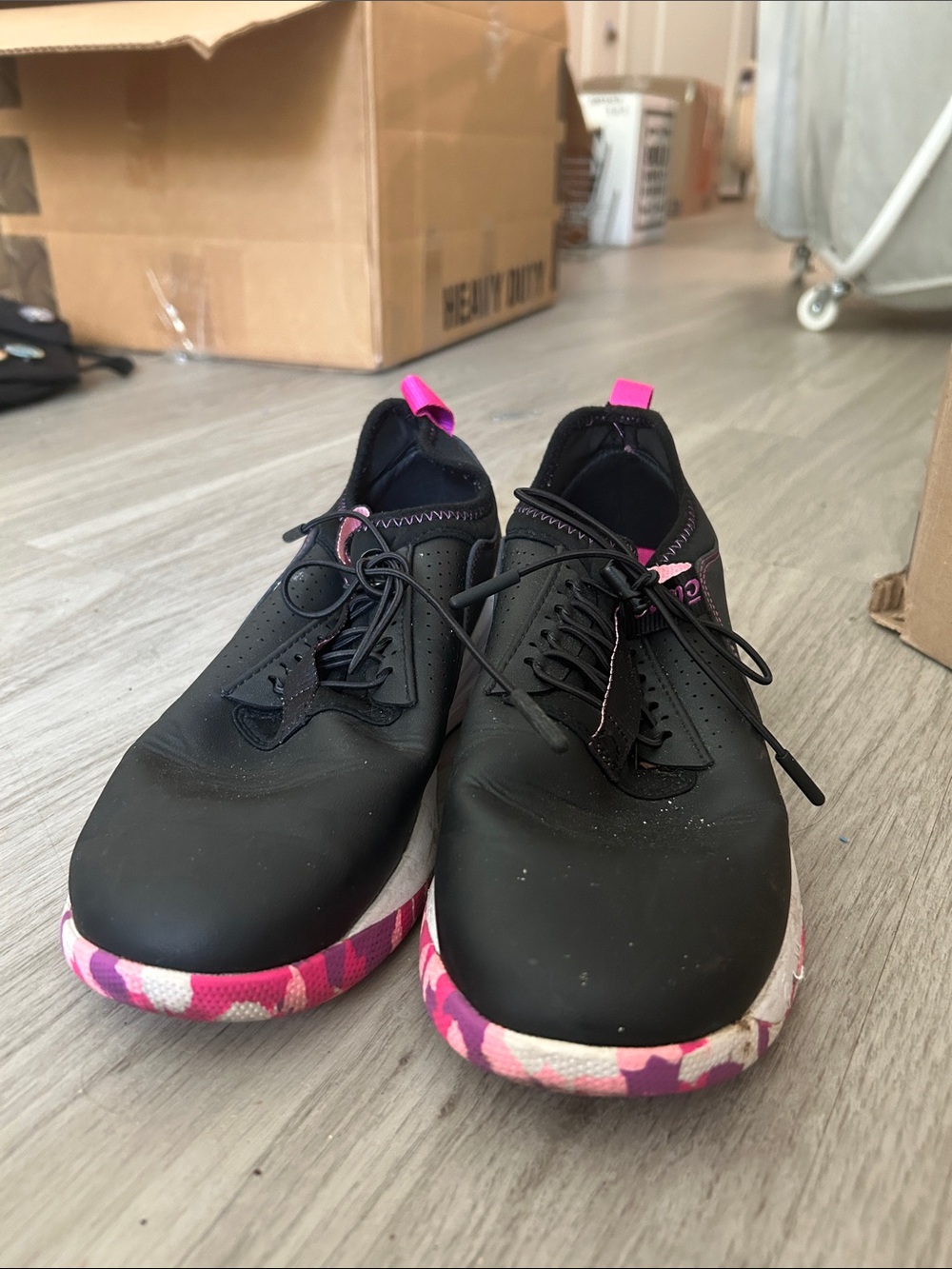 Women’s Black Slip-On Sneakers with Pink Camo Sole